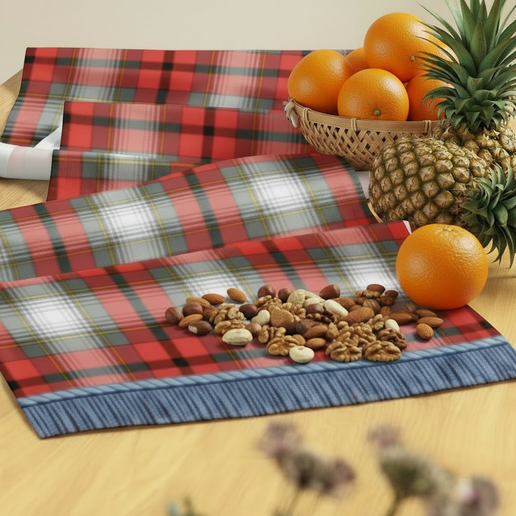 Red, white, grey, gold, and black tartan table runner